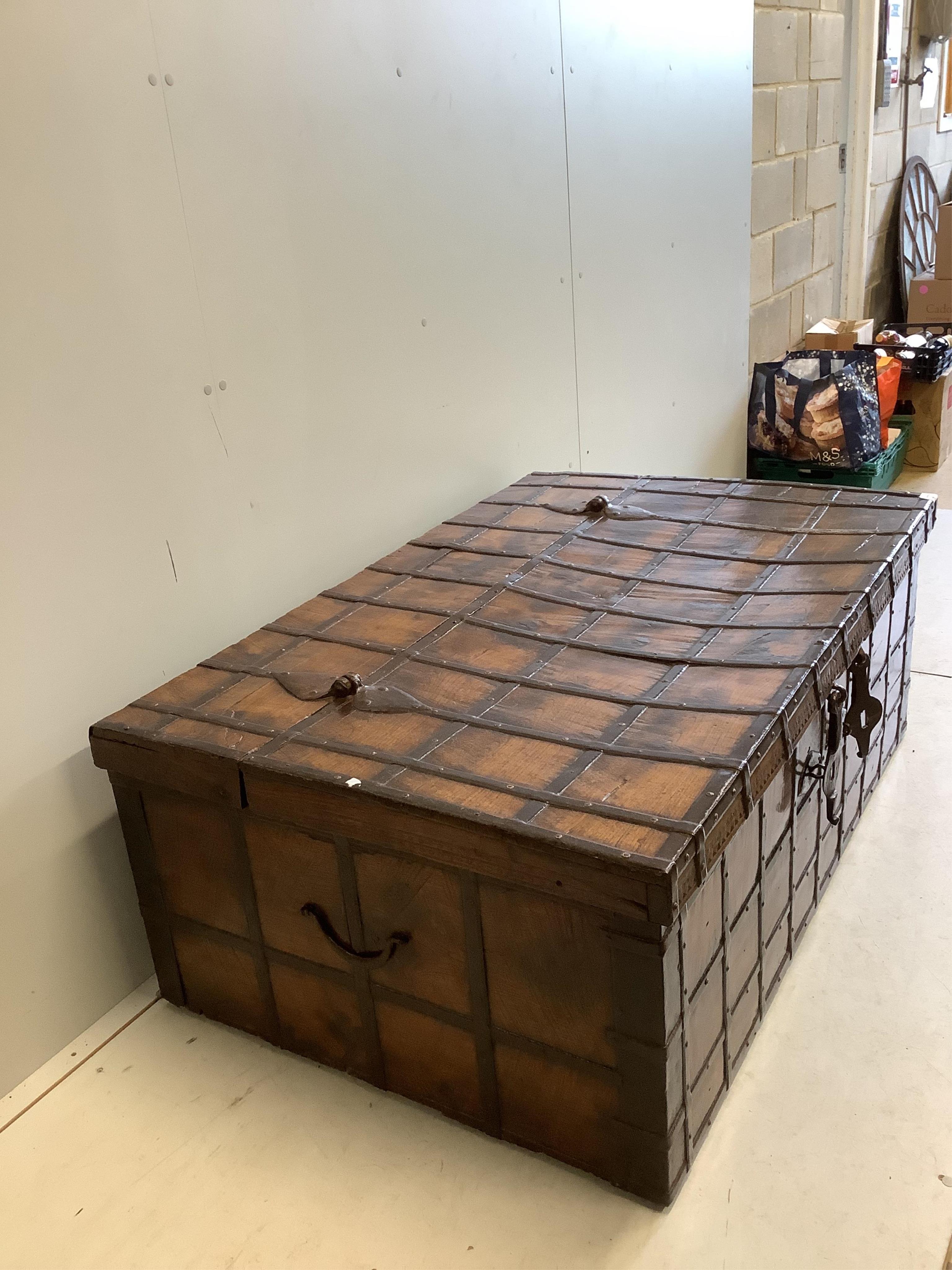 A Spanish wrought iron bound chestnut chest, width 134cm, depth 86cm, height 52cm. Condition - fair to good